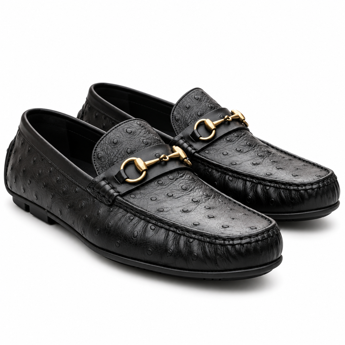 Pair of men's black ostrich-embossed leather loafers with gold bit, three-quarter view