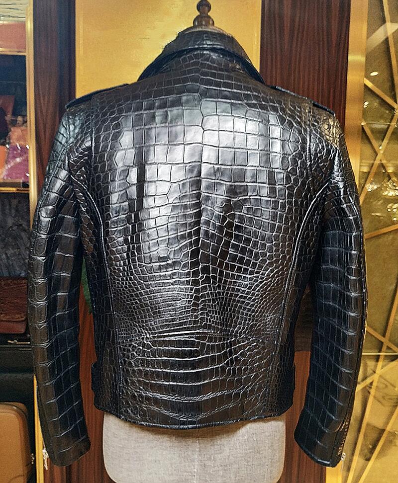 Rare view of Black crocodile skin jacket on a mannequin against a blurred indoor background