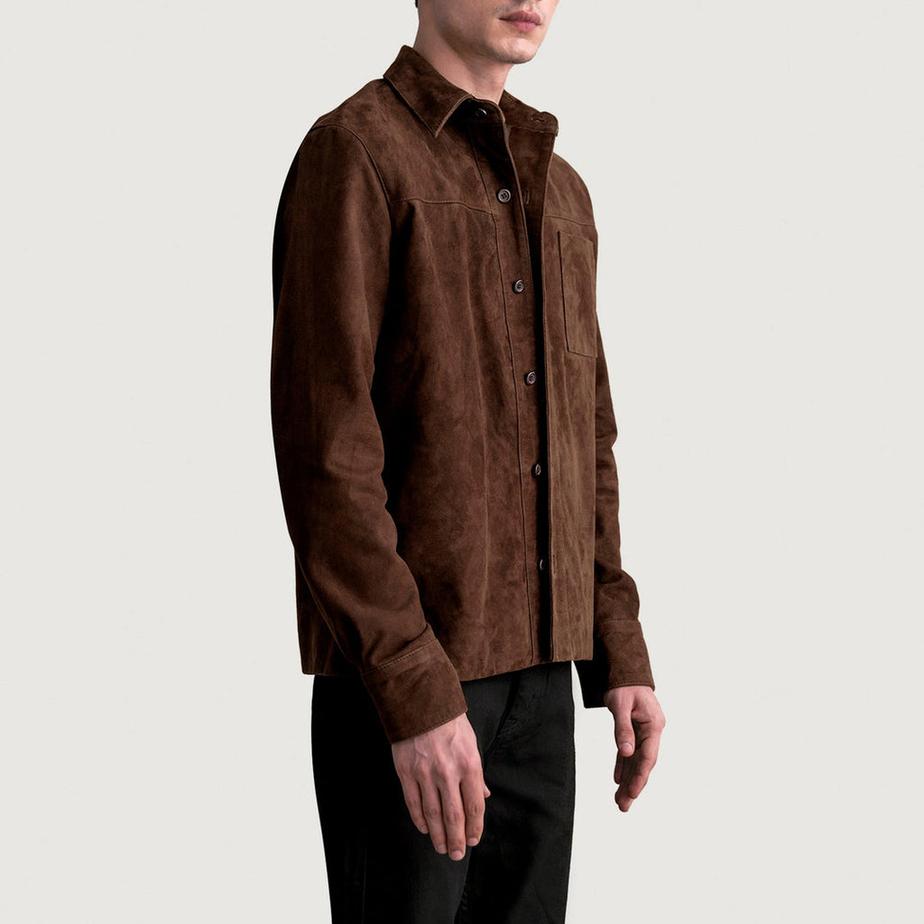 Side profile of a man wearing a men's mocha suede leather shirt jacket and black trousers.