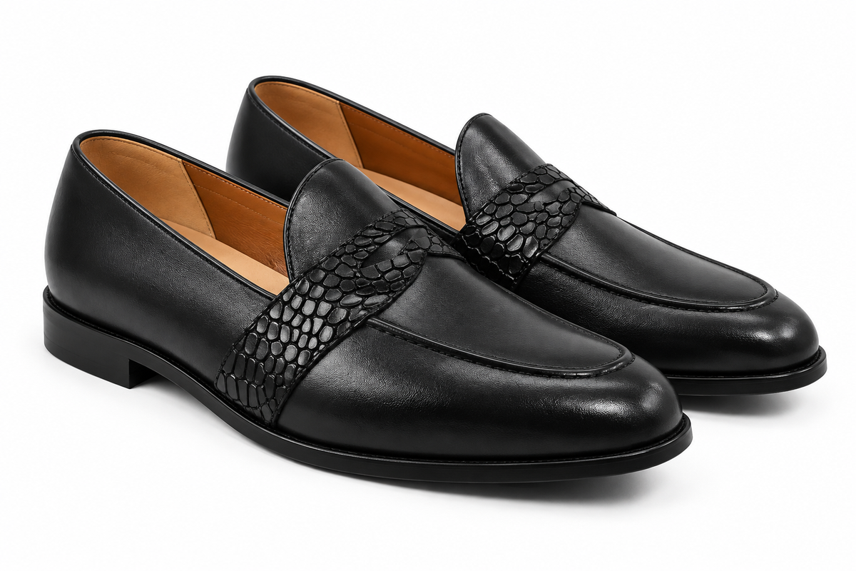 Pair of men's black leather loafers with a croc-textured band across the vamp