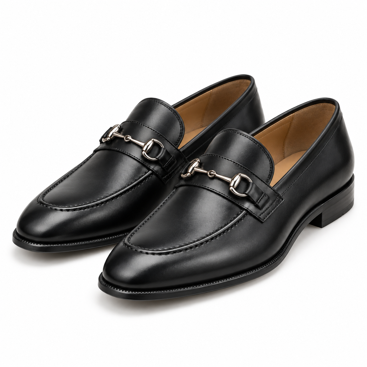 Pair of men's black leather horsebit loafers with silver bit, three-quarter view