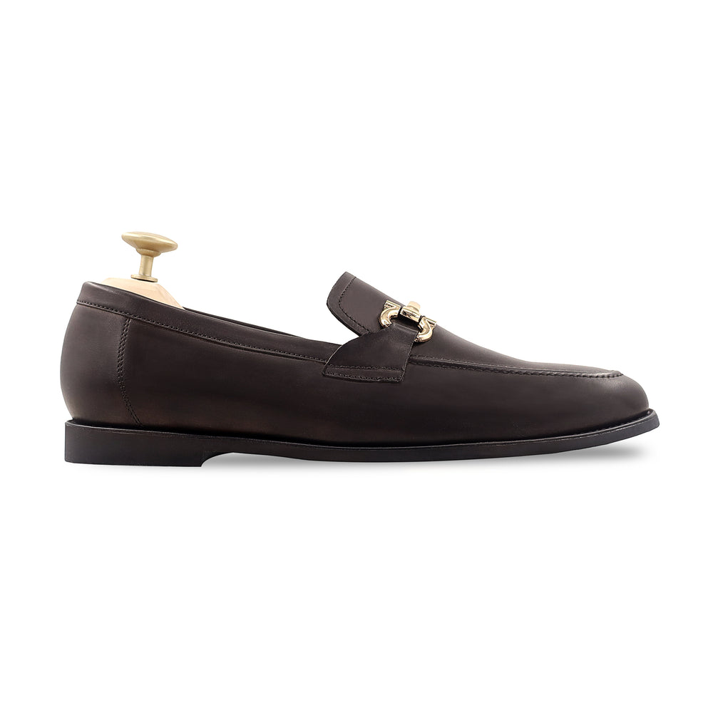 Men's dark brown horsebit loafer with gold bit and shoe tree, side profile